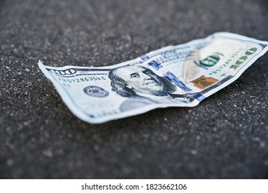 One Hundred Dollar Banknote On The Ground. Lost Money Concept