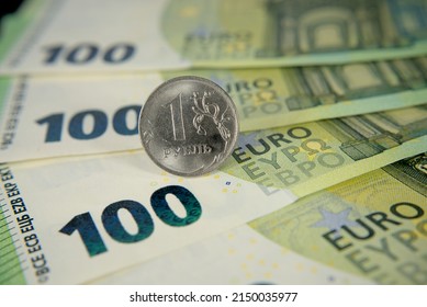 one hundred euro banknotes of the European Union and one Russian ruble macro photo