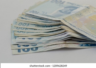 One hundred Turkish liras banknots on white background with copy space.