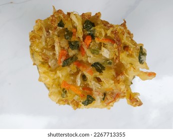 one of indonesian traditional snack it called bala-balla. it is mixed of vegetables like carrot,  green onion, cabbage and wheat flour using some salt for taste. fried in hot oil - Shutterstock ID 2267713355
