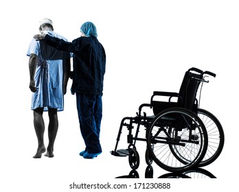 One Injured Man Walking Away From Wheelchair With Nurse In Silhouette Studio On White Background