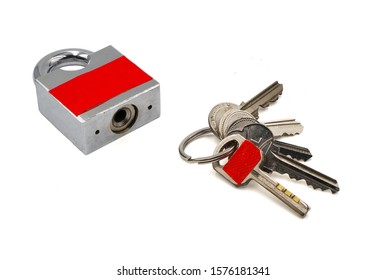 one key with red sticker in key ring which is the same color of padlock , mistake proofing or poka yoke concept as symbol for remind to use the right key ,isolated on white background - Shutterstock ID 1576181341