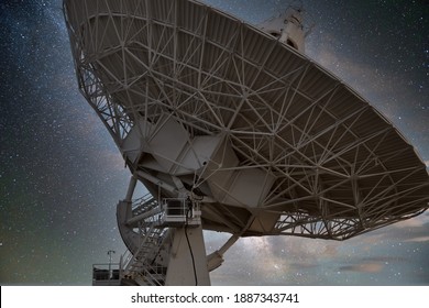 One of the large antenna dishes in the Very Large Array radio astronomy site in New Mexico - Shutterstock ID 1887343741