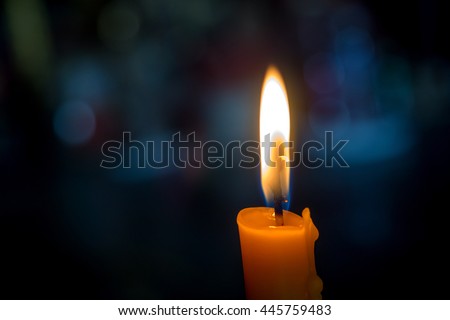One light candle burning brightly with bokeh background