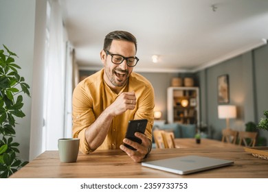 One man adult caucasian male with beard and eyeglasses stand at home happy smile use mobile phone smartphone to make a call talking video call copy space - Shutterstock ID 2359733753