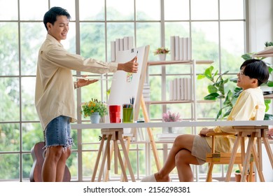 One Man As Couple Gay With Other Draw And Paint The Painting In Living Room With Day Light. Concept Of Happy Activity Together For Lgbt People.