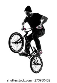 one  man exercising bmx acrobatic figure in silhouette studio isolated on white background