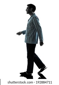 One Man In Pajamas Walking Silhouettes On White Background