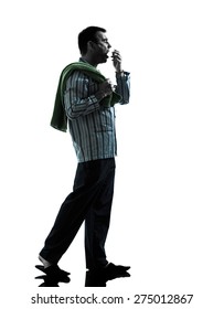 One Man In Pajamas Walking Tired Yawning Silhouettes On White Background