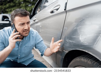 One man reporting car damage calling insurance service