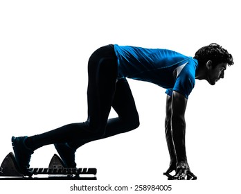 One  Man Runner Sprinter On Starting Blocks In Silhouette Studio Isolated On White Background