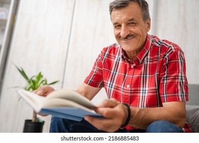 One Man Senior Caucasian Male With Mustaches Read Book At Home Wear Red Shirt Real People Leisure Concept Copy Space Looking To The Camera Happy Smile