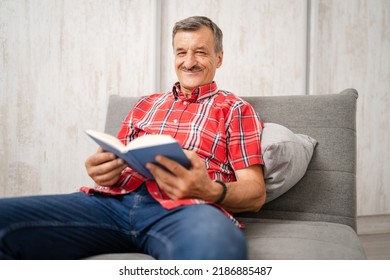 One Man Senior Caucasian Male With Mustaches Read Book At Home Wear Red Shirt Real People Leisure Concept Copy Space Happy Smile Looking To The Camera