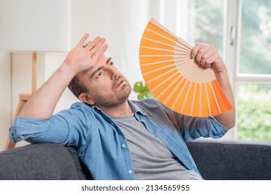 One Man Suffering Summer Heat At Home Trying To Cool Off