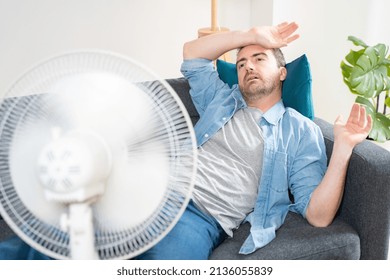 One Man Suffering Summer Heat At Home Trying To Cool Off