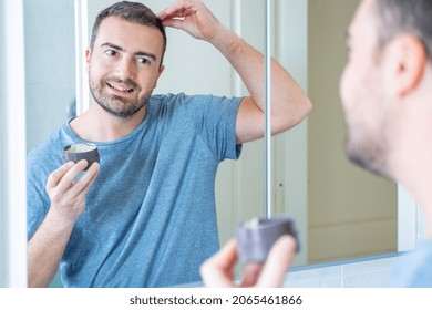 One Man Using Energizing Hair Treatment Cream