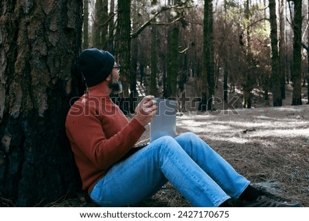 One man using technology connection in nature park forest woods. Remote worker small travel business lifestyle people. Working in the nature alternative office. Small business. Travelers job life