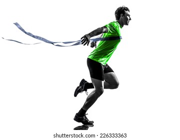 one  man young sprinter runner running winner at finish line in silhouette studio on white background