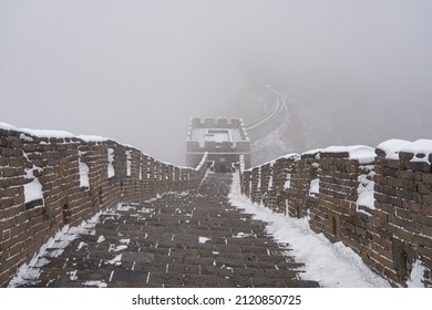 One Of The Many Towers Of Great Wall Of China Are Abonve And The Fog Is Reaching It.