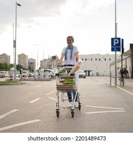 One Mature Woman Caucasian Female Walking In The Parking Lot In Front Of The Shopping Center Grocery Store Supermarket Pushing Chart Happy Smile Full Length Copy Space