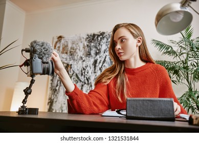 One Minute...Portrait Of Female Blogger Setting Up Her Tripod Mounted Digital Camera While Making A New Video At Home