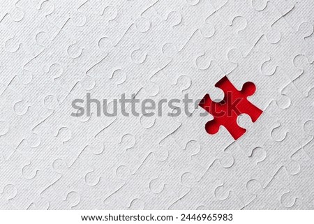 One missing piece in diagonal puzzle on red background. Сoncept of finding business solution. Selective focus, copy space