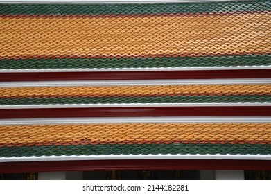 One missing tile in the colorful pattern of roof tiles in the Wat Pho (aka Wat Phra) which is a Buddhist temple complex in the Phra Nakhon District, Bangkok, Thailand