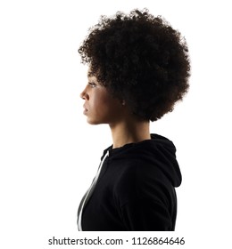 one mixed race african young teenager girl woman serious portrait in studio shadow silhouette isolated on white background