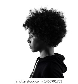 one mixed race african young teenager girl woman serious portrait in studio shadow silhouette isolated on white background