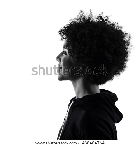 one mixed race african young teenager girl woman in studio shadow silhouette isolated on white background