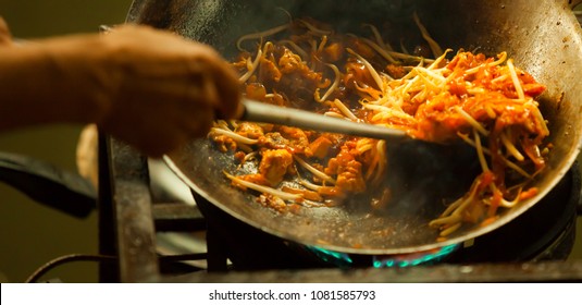 one of most favorite and famous Asian Thai street fast food in hot pan, Pad Thai (Phad Thai), is stir fried rice noodle dish commonly served as a street food and at casual local eateries in Thailand.