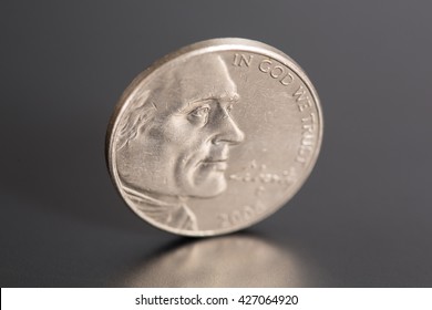 One Nickel on a Black Background