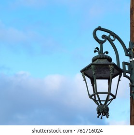 One Old Ancient Lamp Or Lantern For A Streetlight Closeup Against The Background Of The Sky