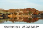 One old iron bridge cross the Delaware river between two old town in autumn