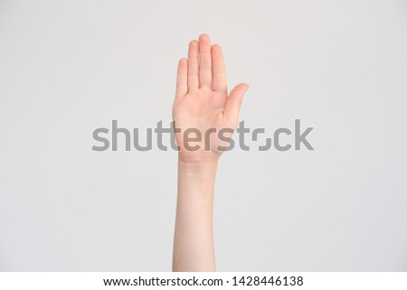 One opened child's handbreadth on a neutral background