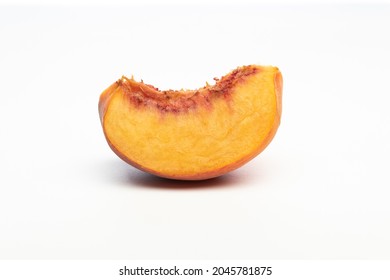 One Peach Wedge, Isolated On White Background