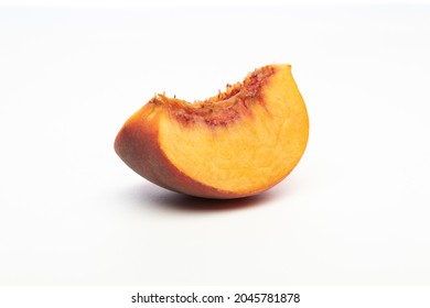 One Peach Wedge, Isolated On White Background