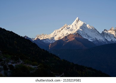 one of the peaks of meili snow mountain under the blue sky in yunnan province, china