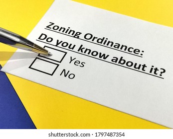 One person is answering question about zoning ordinance. - Shutterstock ID 1797487354