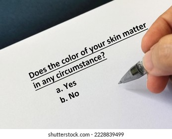 One person is answering question about racism. He is thinking if the color of his skin matters in any circumstance. - Shutterstock ID 2228839499