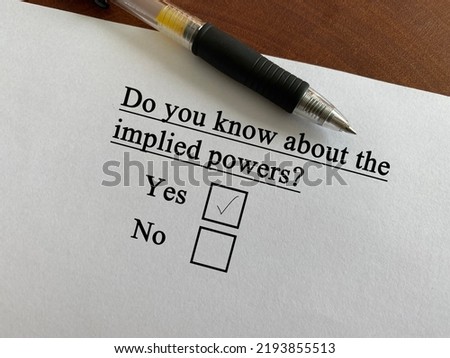 One person is answering question about politics. He knows about implied powers
