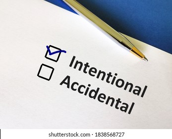 One person is answering question. He is choosing between intentional and accidental. - Shutterstock ID 1838568727