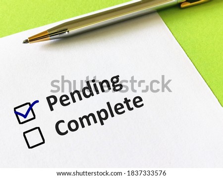 One person is answering question. He is choosing between pending and complete.