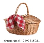 One picnic wicker basket with checkered napkin isolated on white