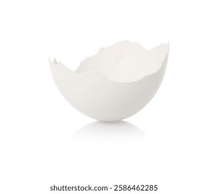 One piece of broken eggshell on mirror surface against white background