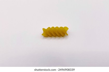 One piece of raw fusilli pasta isolated on white - Powered by Shutterstock