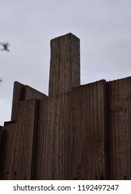 One Piece Of Wood Protruding From Wooden Fence