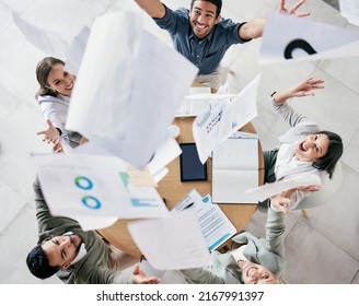 One Positive Thought Can Change Your Whole Day. Aerial Shot Of A Diverse Group Of Businesspeople Throwing Paperwork In The Air In Celebration While In The Office.