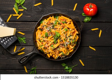 One Pot Pasta From Above. This Quick & Delicious Pasta Meal Is Made With Penne Pasta, Fresh Tomato Sauce And Sausage. This Italian Inspired Comfort Food Is Cooked And Served In A Cast Iron Skillet.