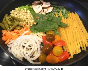 One pot pasta ingredients in a skillet			